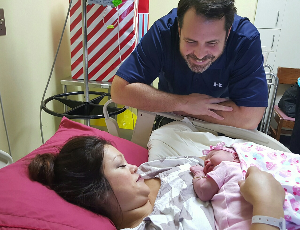 Proud prents Harrison and Andrea Klaus Royer admire daughter Athena Lee, the territory's first baby of 2016. (Photo provided by Juan F. Luis Memorial Hospital)