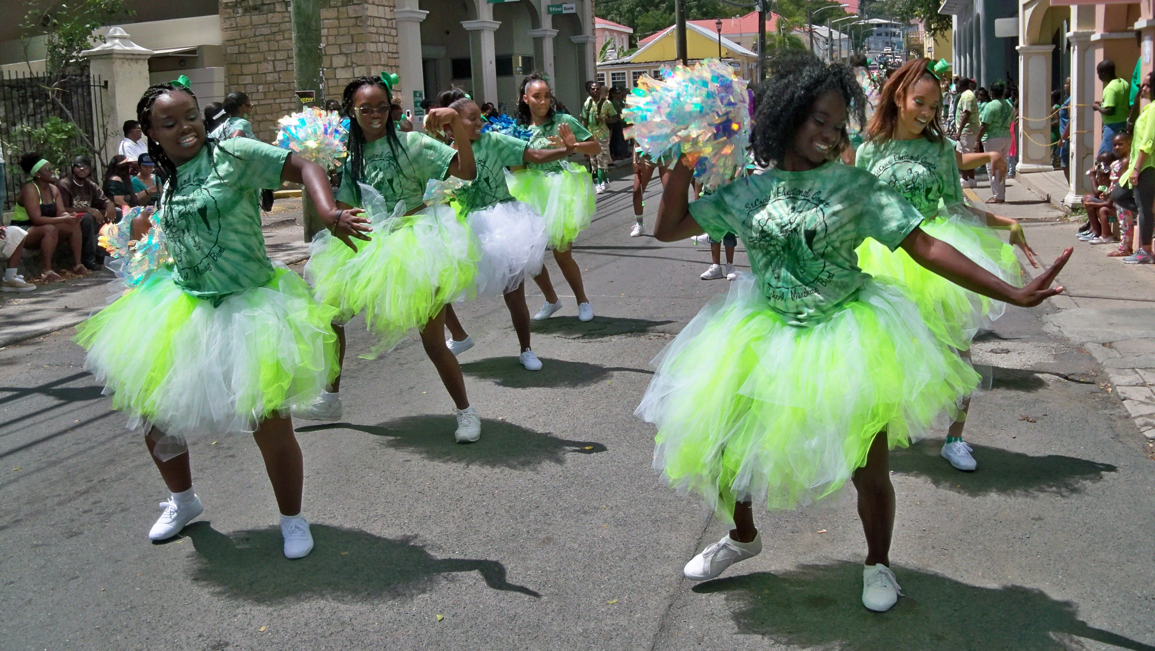 Dancers from the St. Croix Educational Complex twirl in vibrant green tutus.