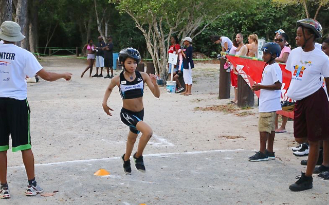 Shaiah David crosses the finish line Saturday.