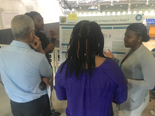 Travis Jarvis and Shanice James presenting their research project, 'Do Sounds of Nature Affect Sleep?' at the UVI Summer Research Symposium.