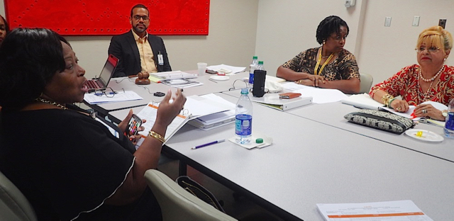 JFL board members, from left, Vera Falu, Troy de Chabert-Schuster, Theresa Frorup-Alie and Aracelis de Hendry-Walcott discuss financial matters at Monday&rsquo;s board meeting.