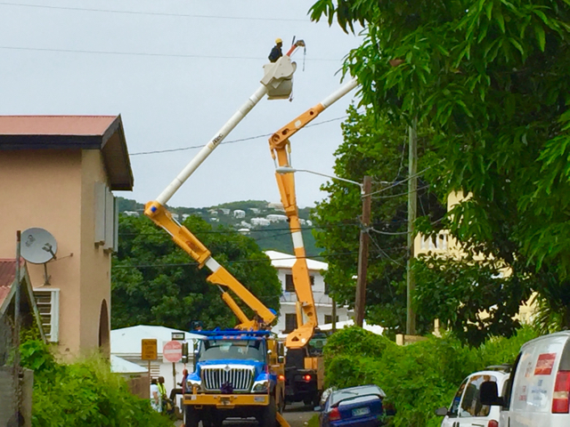 WAPA line crews use two bucket trucks to make powerline repairs in Frenchtown following an incident where a man was electrocuted Sunday afternoon.