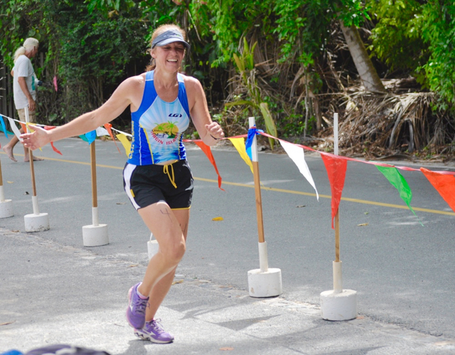 St. Croix athlete and V.I. Triathlon Federation Secretary Theresa Harper crosses the finish line.