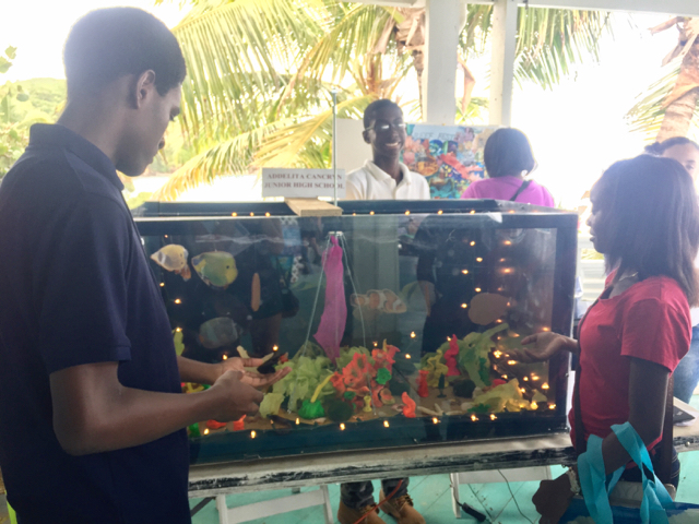 Students from Addelita Cancryn Junior High School share their aquarium exhibit made of all recycled items.