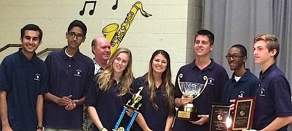 The Antilles School Brainstorms celebrate winning the territorial Quiz Bowl competition.