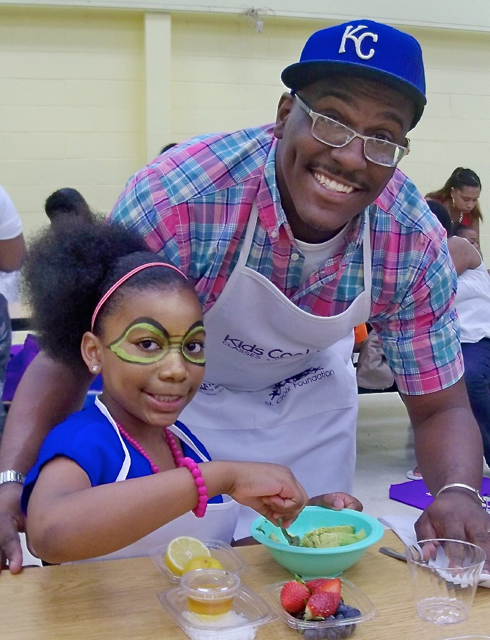 Genesis Clark and her dad, Greg Clark Jr., take part in a father-daughter event.