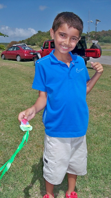 Alexander Pahlavan, 9, shows off the little kite he made. 