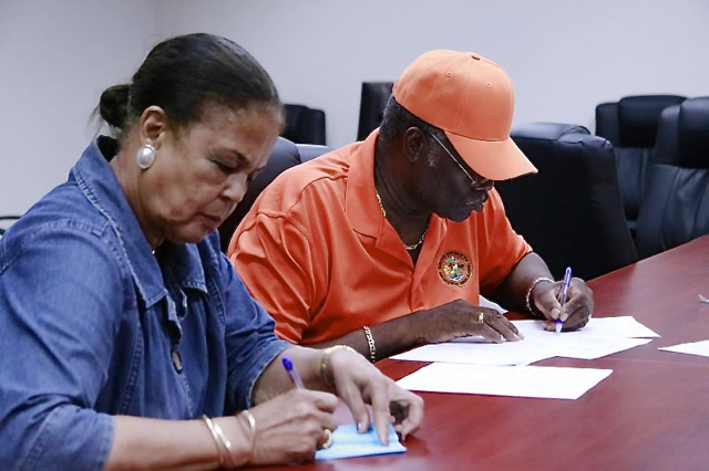 St. Thomas-St. John Board of Elections member Harry Daniel reads the unofficial results while member Wilma Marsh-Monsanto records the tally. (James Gardner photo)