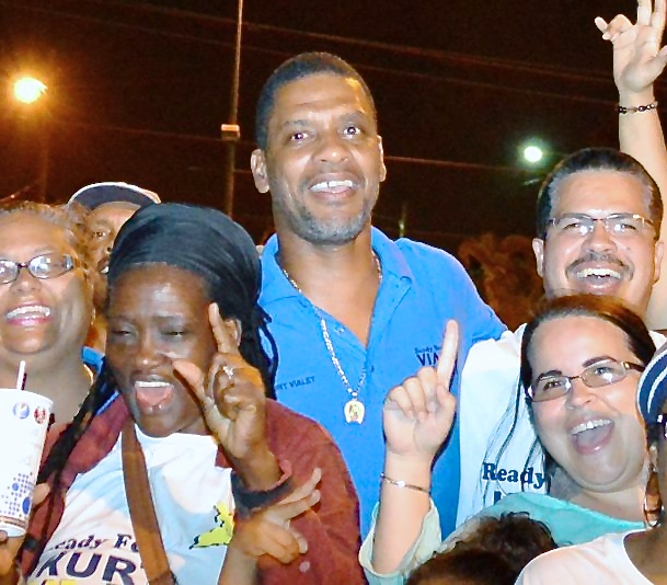 Kurt Vialet celebrates with supporters Saturday night outside of the Elections Office in Sunny Isles. (Bill Kossler photo)