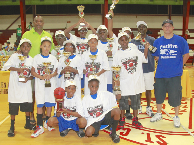 The champions of the 2013 Allen D. Burke Basketball Tournament wave their trophies.