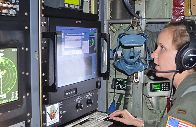2nd Lt. Leesa Froelich keeps her eyes locked on her instruments as the Hurricane Hunters probe the storm.