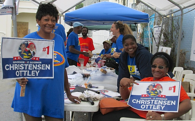 Myia Powell, Barbara Thompson with Sherry Boynes-Jackson behind Barbara, brave the weather to support their candidates..