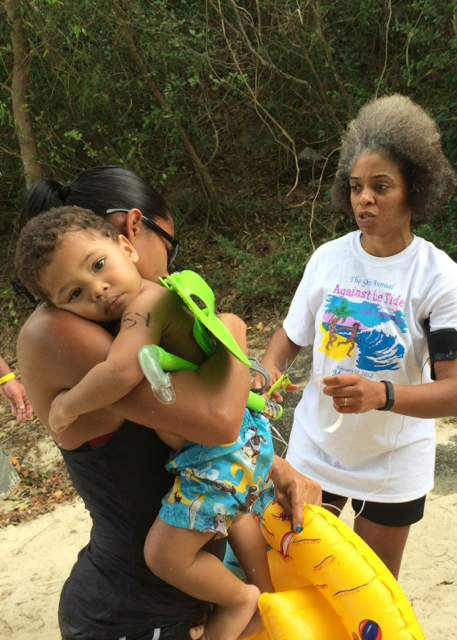 Camelia Febres holds son Carmelo, who was officially the youngest participant in Race Against the Tide.