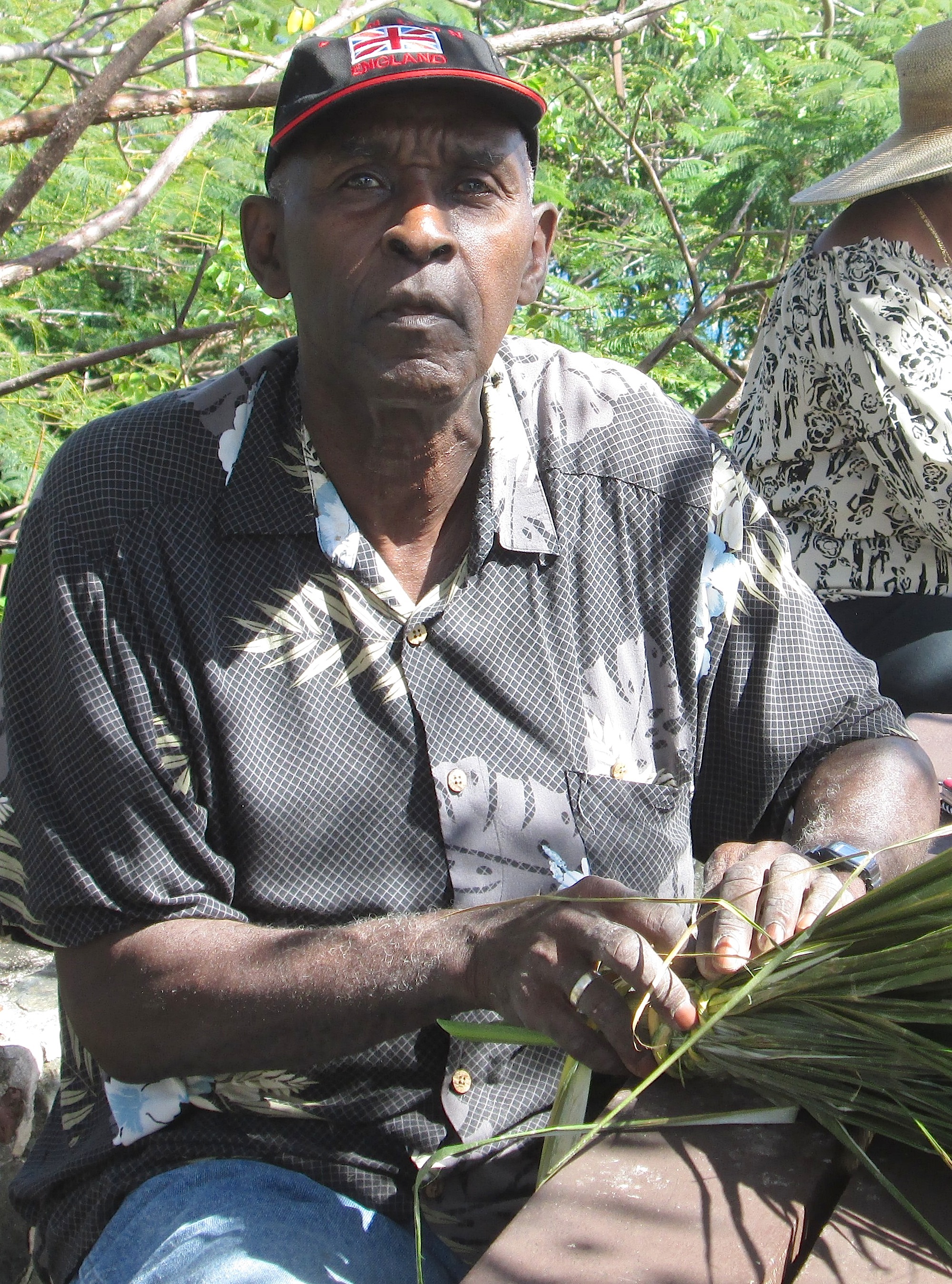 Edmond Roberts make booms out of tyre palm fronds.