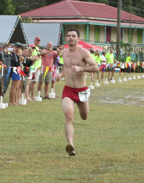 Rick Pahl, of Muscatine, Iowa, crosses the finish line in first place.