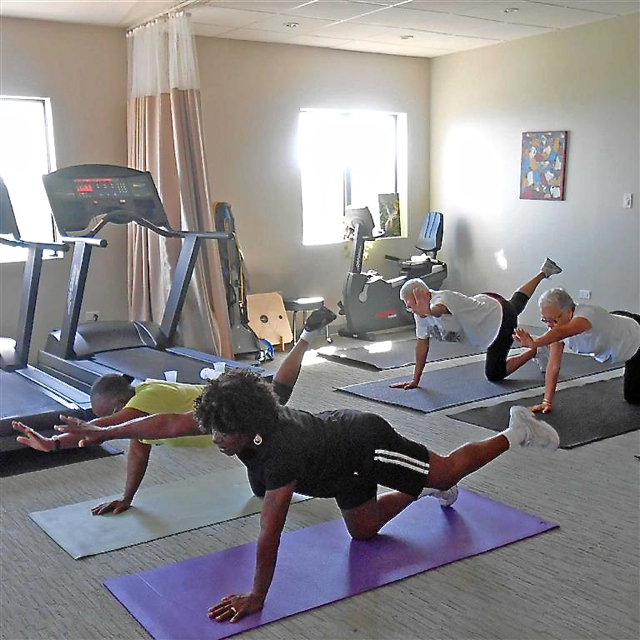 Four women work out at Synergy's gym.