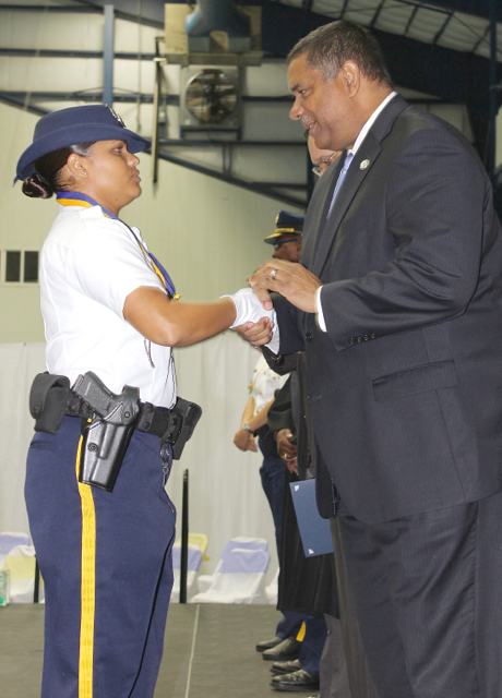 Gov. John deJongh Jr. congratulates Police Officer Tianna Hunt at Friday's promotion ceremony.