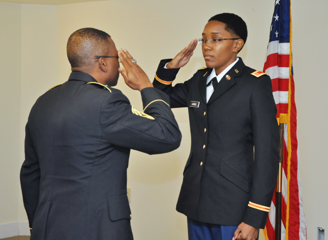2nd. Lt. Shenelle Gabrielle receives her first salute from Master Sgt. Russell Keller, senior military instructor.