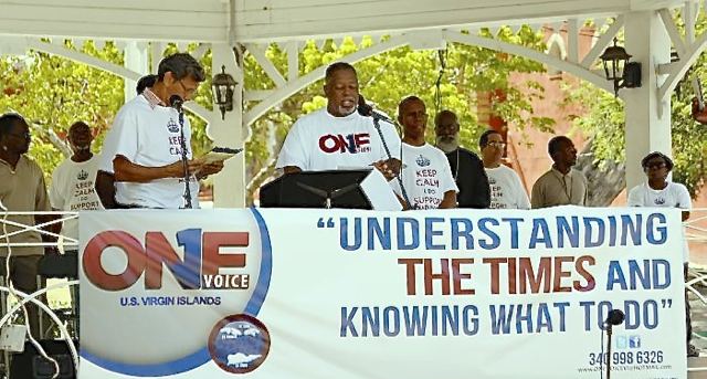 Members of One Voice Virgin Islands speak at Thursday morning's rally in Emancipation Garden.