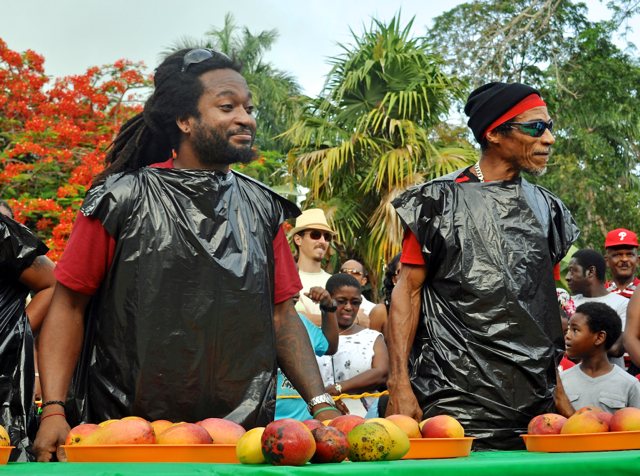 Olubayo Kaza, left, and Hector Gordon Sr. prepare to clash in an uinprecedented mango-eating contest.