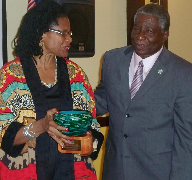 Lt. Gov. Gregory Francis congratulates Denise Bennerson on winning the 2013 St. Croix Nascent Small Business of the Year award. 