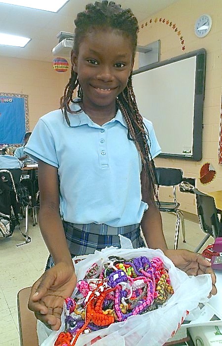 Bowsky Elementary fifth-grader Chenayah Thomas shows off her handmade jewelry.
