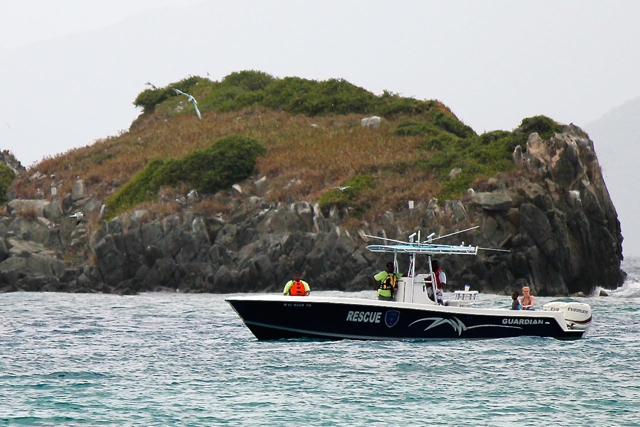 St. Thomas Rescue keeps a close eye on swimmers as they round Shark Island.