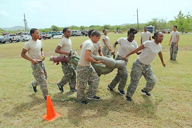 Trainees practice the six-man carry in first aid exercises. (Photo provided by V.I. National Guard)