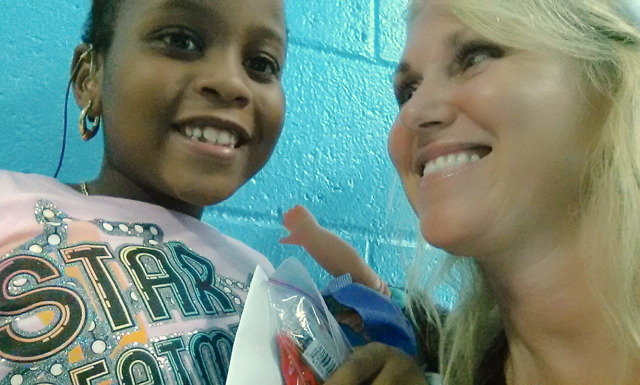 Keinesia Godwin, a deaf girl, meets camp director Norma Lee Oldfield.