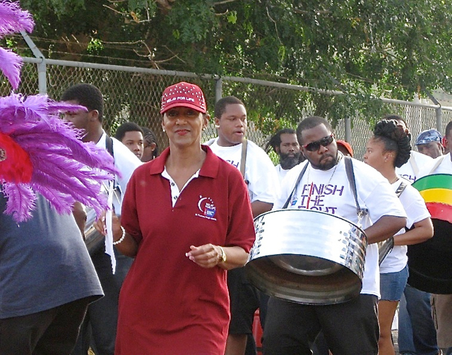 Lorraine Baa, executive director of American Cancer Society U.S.V.I., marches with Rising Stars Steel Orchestra in the Relay for Life Saturday.