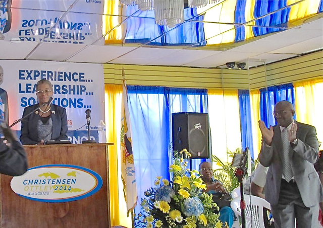 Basil Ottley Jr. applauds while gubernatorial candidate Donna Christensen speaks during their campaign announcement Saturday morning on St. Croix.