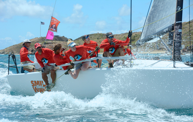 The crew of Smile and Wave rides the rail. (Dean Barnes photo) 