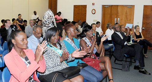 Miss UVI 2014 contestants and reigning Miss UVI Murchtricia Charles, second from left, applaud keynote speaker Palmer. (Photo provided by UVI)