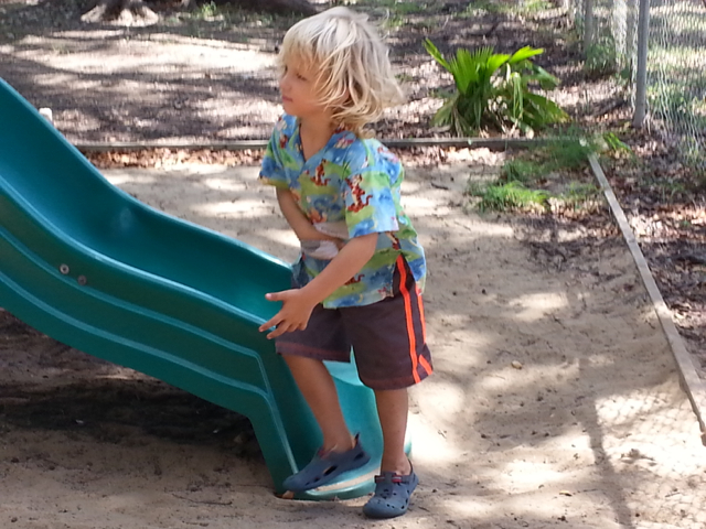 Robert Stewart plays on the slide Saturday at the Frederiksted Boys & Girls Club.