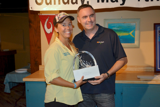 Beth Basinski accepts the Top Angler award from Kevin Lambert of sponsor Budget Car Rental. (Photo by Dean Barnes)