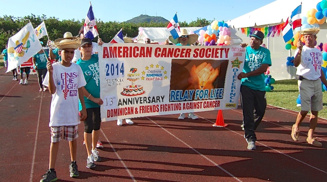 Cancer survivors parade around the track Saturday duriung the opening of the Relay for Life.