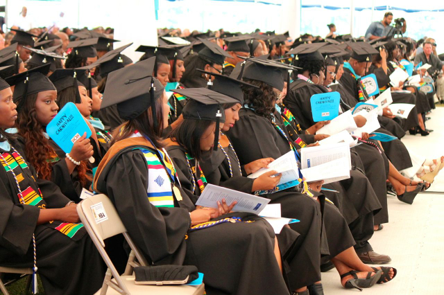 UVI graduates listen to speakers at commencement ceremonies on St. Croix Sunday.