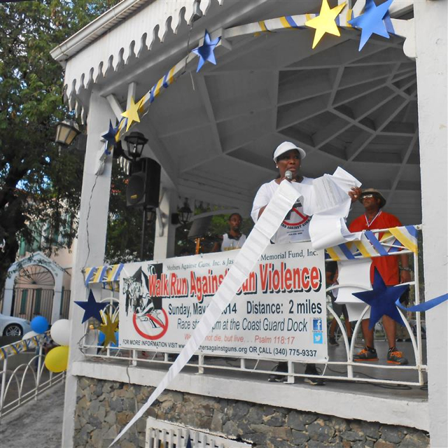 Celia Carroll unfurls the list of the territory's homicide victims since 1999.