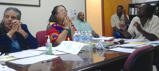 Lisa Harris-Moorhead and Liliana Belardo de O'Neal listen to Chairman Adelbert Bryan at the St. Croix Elections Board meeting Wednesday. 