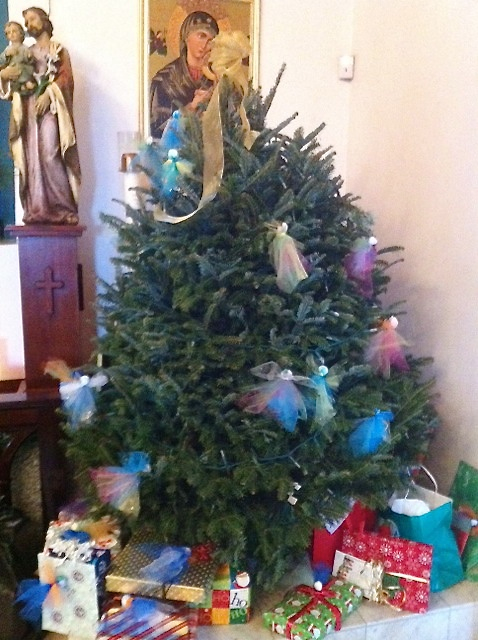 The Angel Tree at Our Lady of Perpetuial Help Church on St. Thomas bears the names of children who need Christmas cheer.