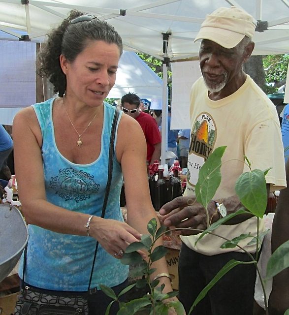 Donna Matthias gets plant advice from Charles Leonard at the Bizarre Bazaar.