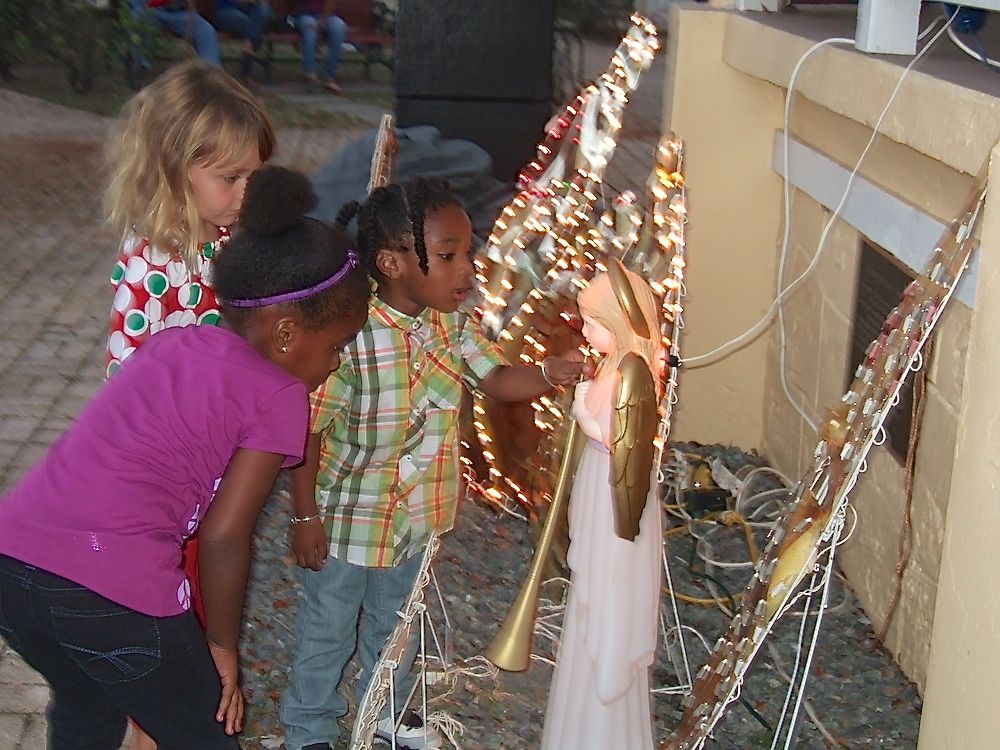 Youngsters examine the intricate holiday lights in the Frederiksted gazebo.