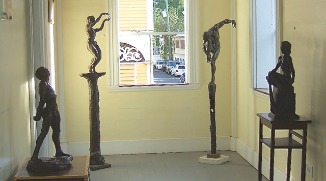 Elicker's bronze sculptures frame a window in his new gallery.