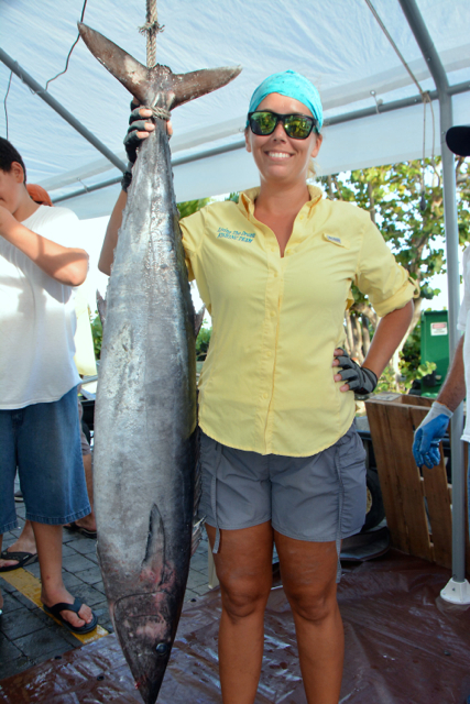 Beth Basinski poses dockside with her prize-winning 42.35-pound wahoo.