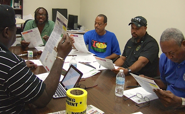The St. Croix Board of Elections reviews the ballot during Sunday's emergency meeting.