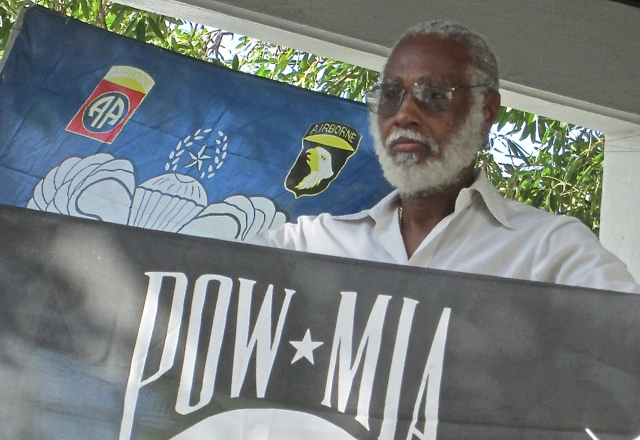 Elmo Rabsatt with POW/MIA flag.