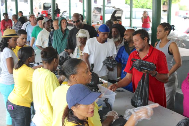 Members of St. Croix's homless community receive donations of food, clothing and other items at Saturday's Fixxers VI's pre-Thanksgiving luncheon in Christiansted.