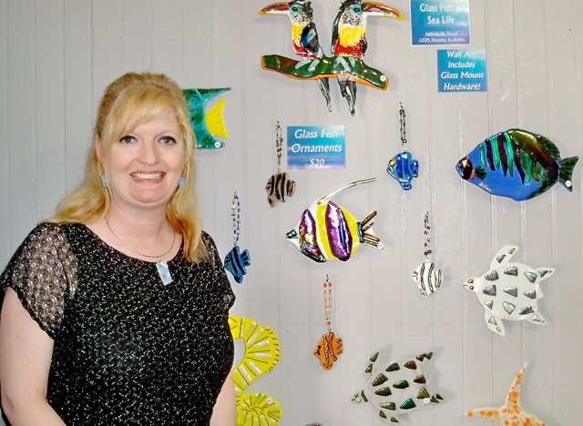 Nicole Brown shows her wall of fused glass.