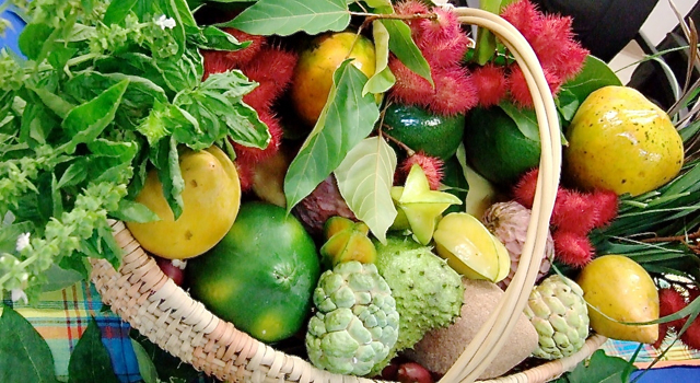 A basic of tropical fruit adorns the book release event at the University of the Virgin Islands.