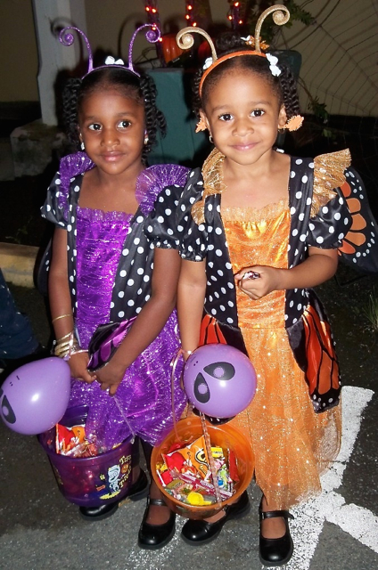 Little butterflies, Brianna Ayala, left, and Lilliana Ayala, enjoy a night at Gallows Bay.